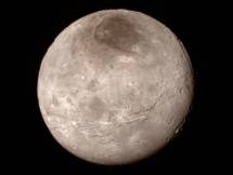 Remarkable new details of Pluto’s largest moon Charon are revealed in this image from New Horizons’ Long Range Reconnaissance Imager (LORRI), taken late on July 13, 2015 from a distance of 289,000 miles. Credit: NASA